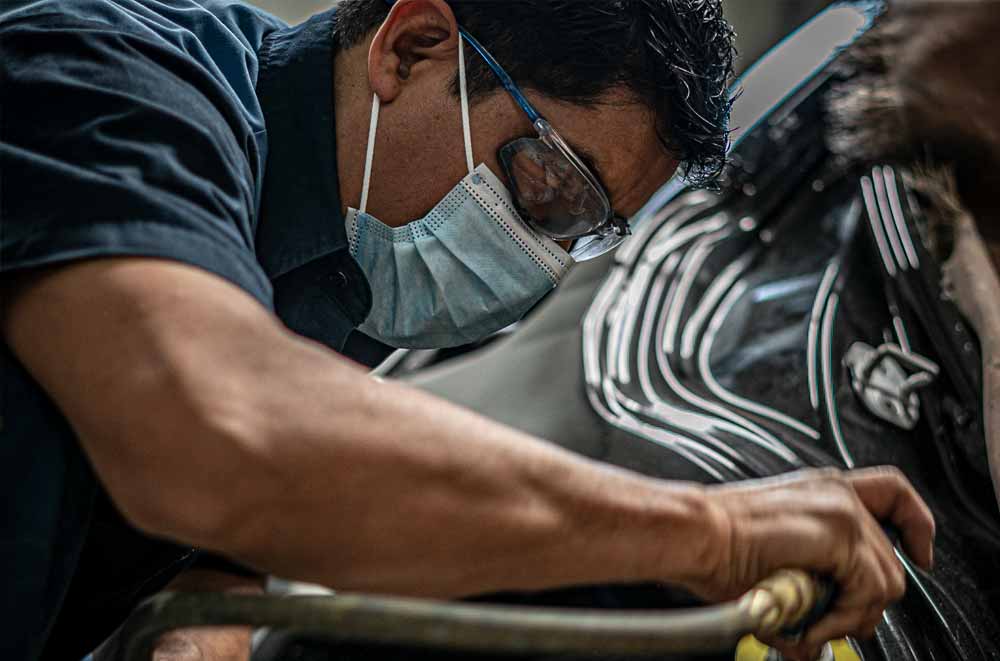 Volkswagen Certified Body Shop - Teck Working on Car