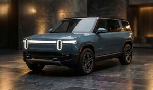Rivian-sitting-under-lights-after-auto-body-repair-Gold-Coast-Auto-Body-Chicago