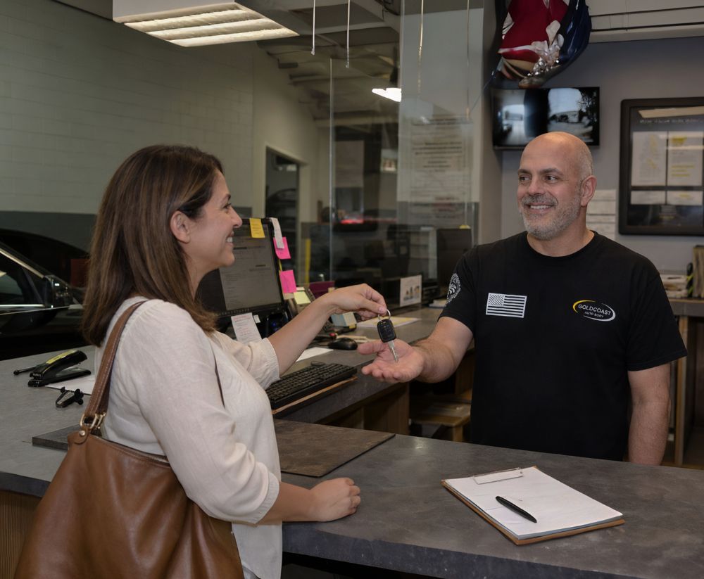 Dominic-Martino-in-gold-coast-auto-body-office-with-customer